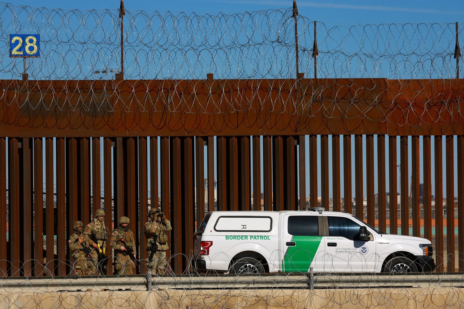 Photo: Members of the Texas National Guard guard near the border wall between Mexico and the United States, as seen in Ciudad Juárez, Mexico, January 14, 2025.