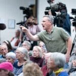 Photo: A man shouts at the Chuck Edwards representative during a meeting of the City Council of Congress on March 13, 2025 in Asheville, North Carolina.